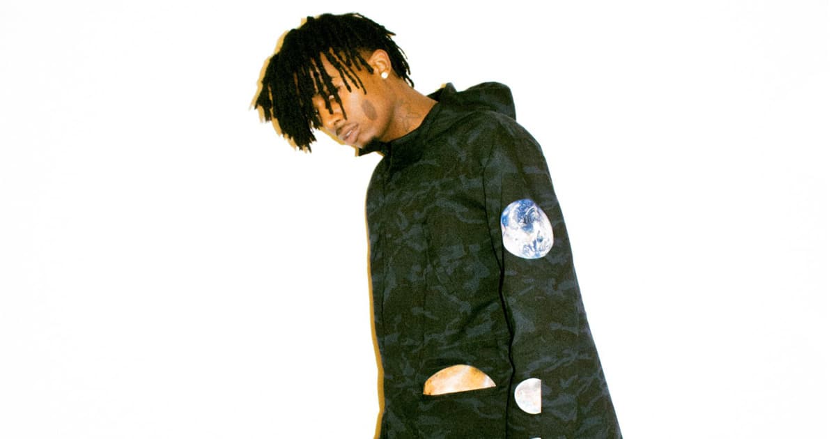 rapper playboi carti posing in new fashion 