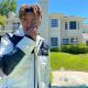 rapper cordae poses in front of mansion