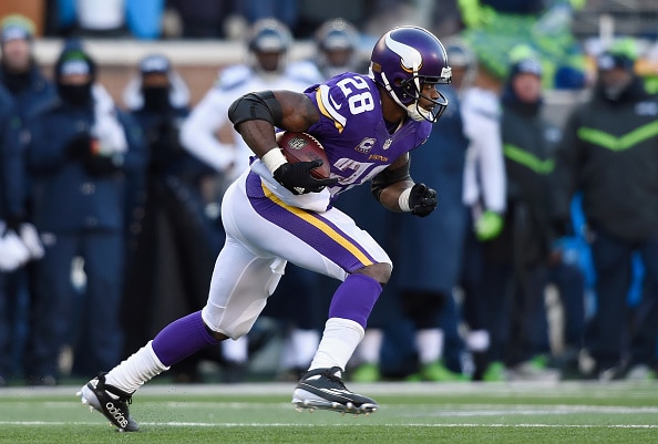 Adrian Peterson running with the ball
