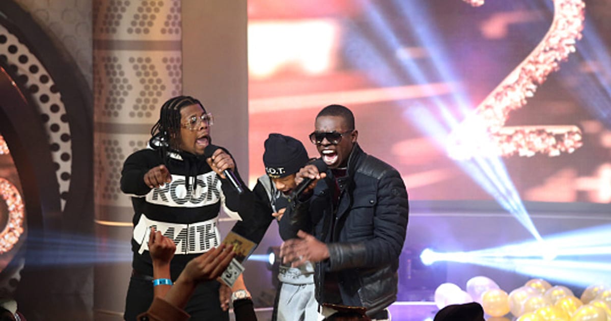 rapper Rowdy Rebel performs on stage alongside Bobby Shmurda in 2014