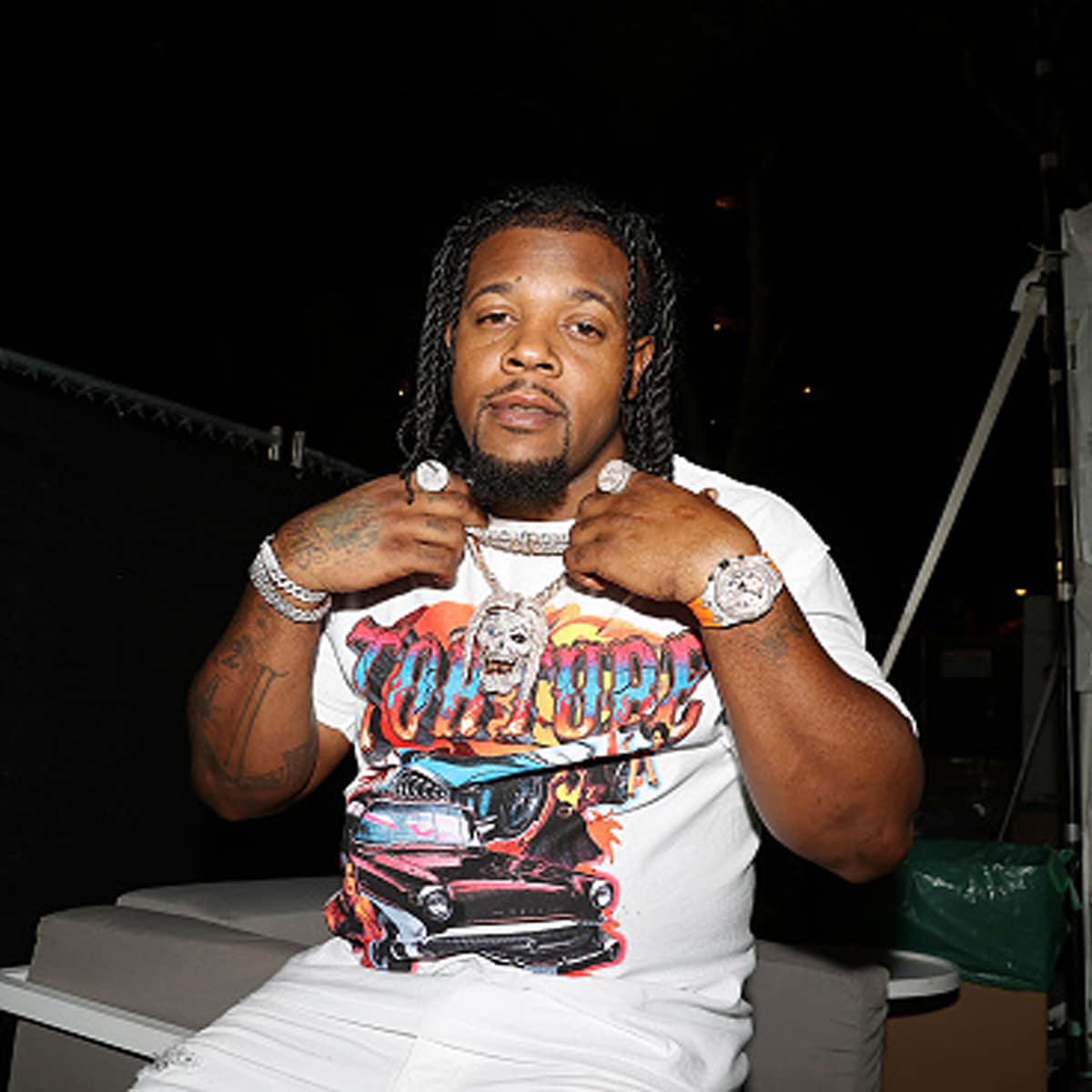 rapper rowdy rebel holding chains at made in america festival