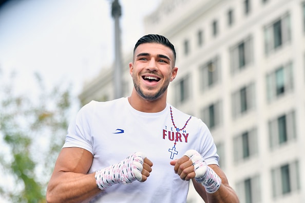 Tommy Fury in a white shirt