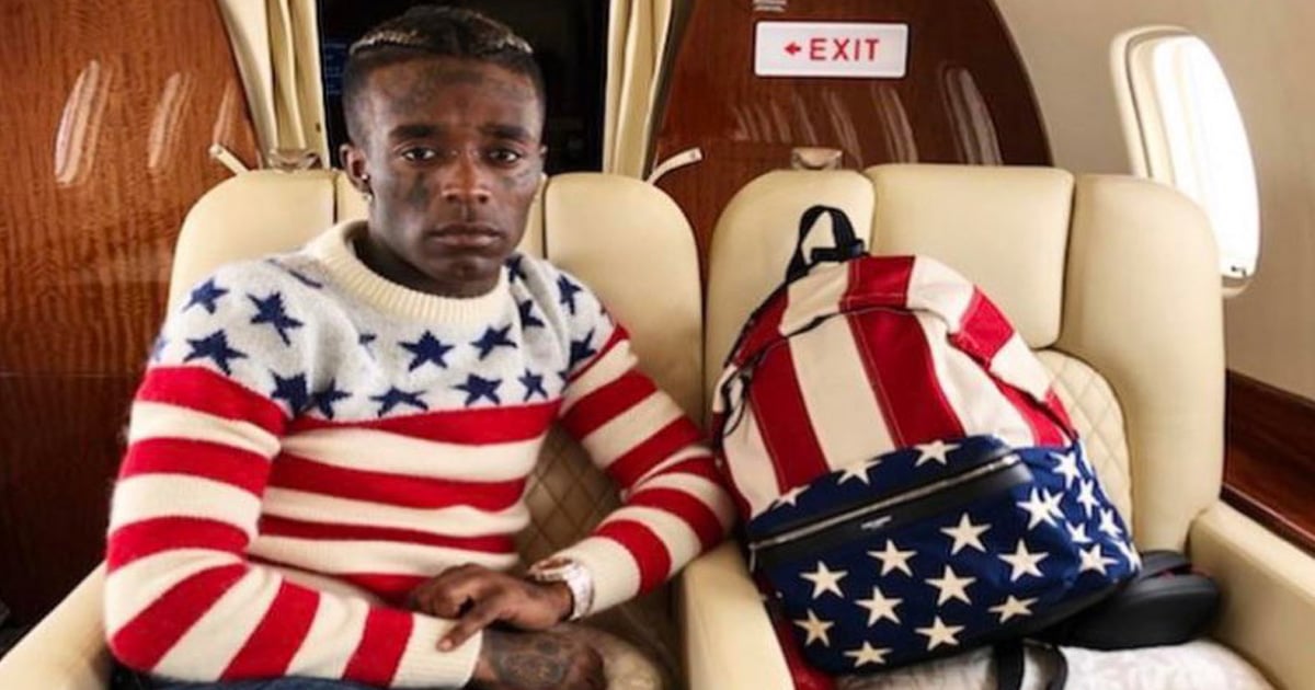 rapper lil uzi vert sits on jet, dressed in american stars and stripes