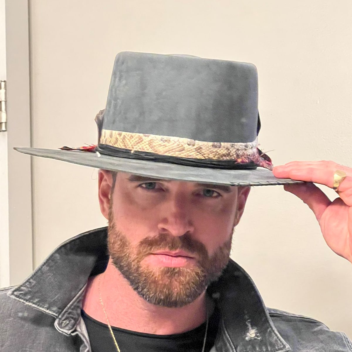 entrepreneur kurt sowers wears hat and denim jacket