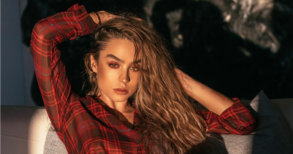 model sommer ray net worth poses in red flannel shirt