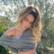 model sommer ray poses in front of nature scene