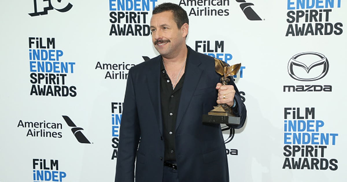 richest actors adam sandler poses with the best male lead award