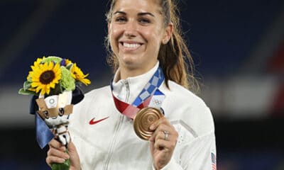 us soccer star alex morgan poses with her bronze medal