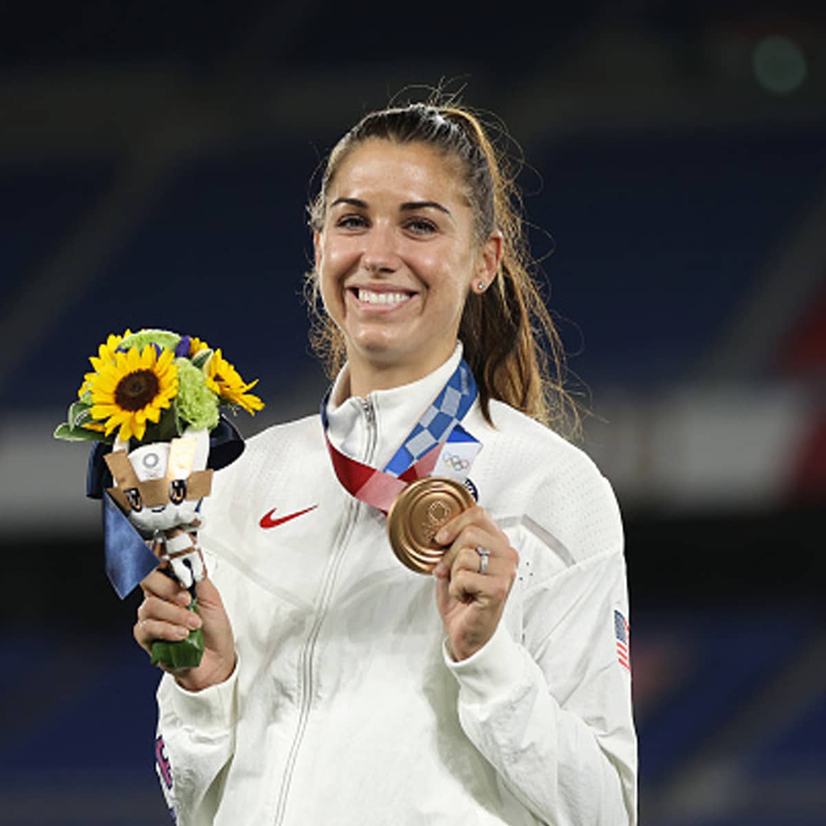 us soccer star alex morgan poses with her bronze medal