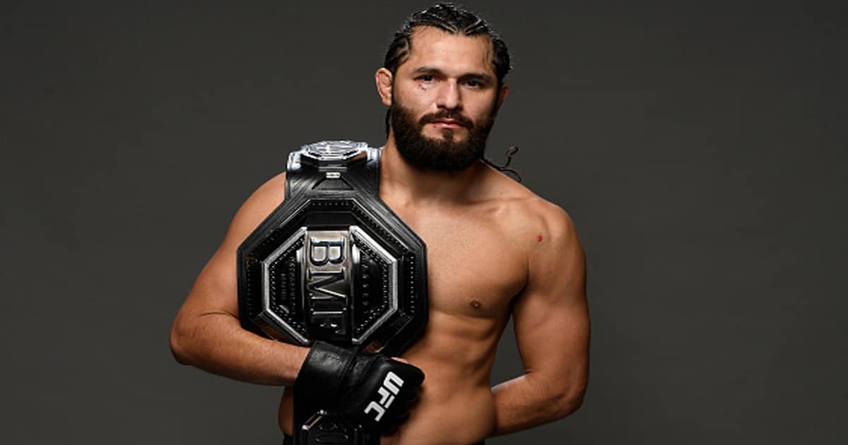 ufc fighter jorge masvidal poses backstage with bmf belt