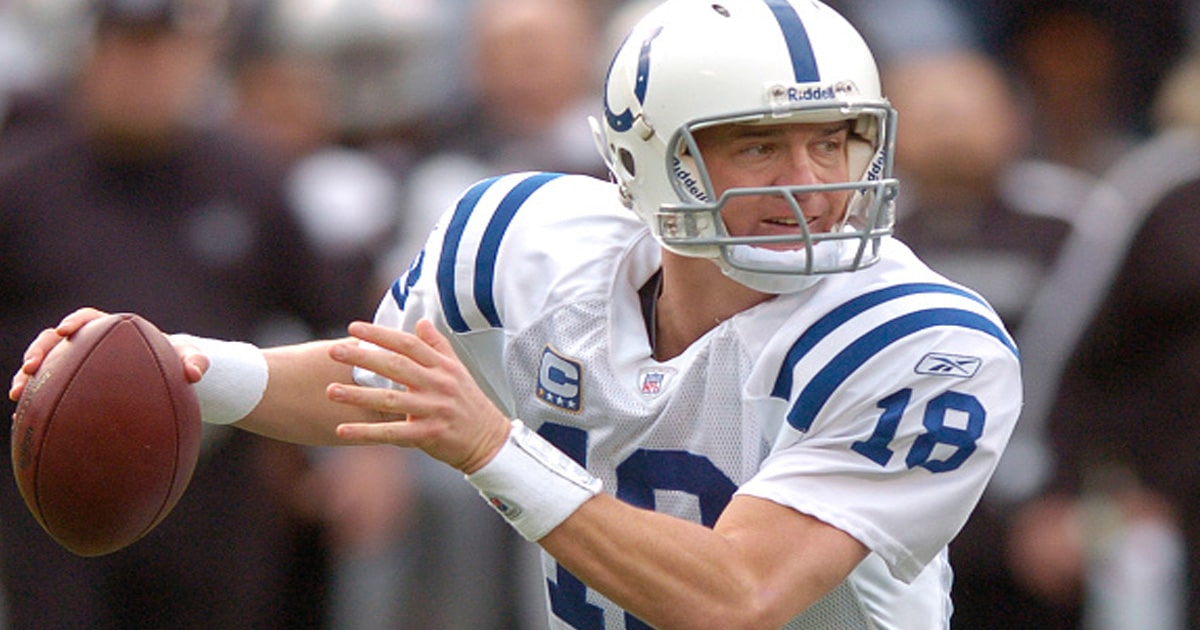 richest nfl players Peyton Manning #18 of the Indianapolis Colts looks to scramble away from the pressure