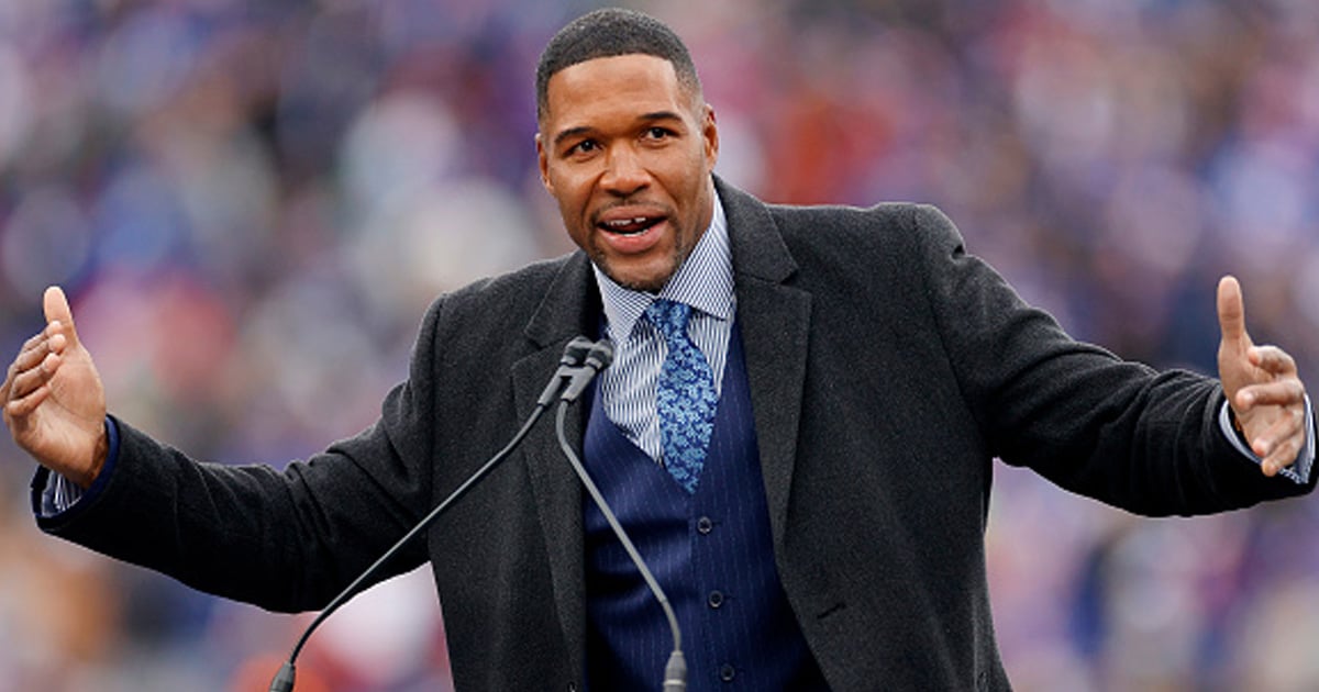 Michael Strahan speaks during the ceremony to retire his number