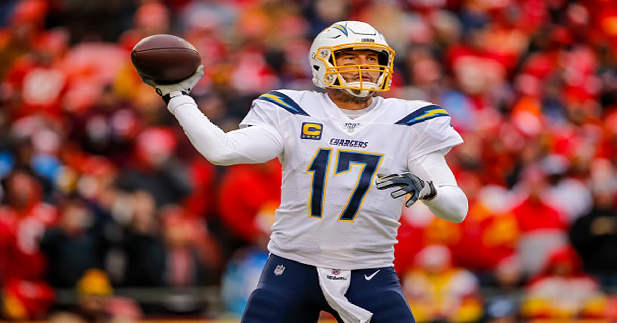 richest nfl players Philip Rivers #17 of the Los Angeles Chargers looks for an open receiver