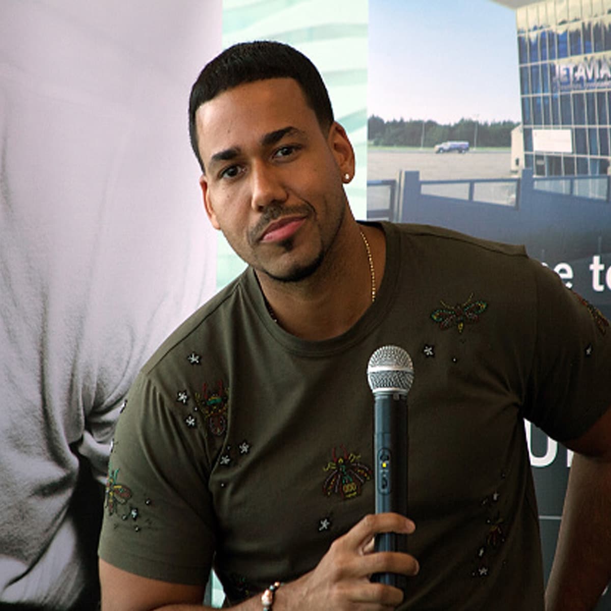 singer romeo santos in press conference at luis munoz international airport