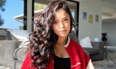 internet personality valkyrae poses in red sweater