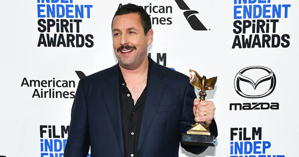 Adam Sandler, winner of Best Male Lead for "Uncut Gems," poses in the press room