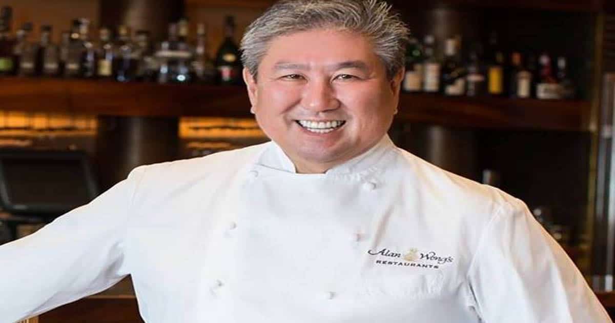 richest chefs alan wong poses in restaurant