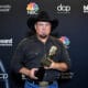 Garth Brooks poses with the Icon Award backstage at the 2020 Billboard Music Awards