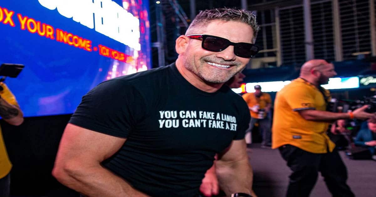 richest authors grant cardone poses in black tee shirt and sunglasses
