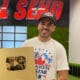 youtuber kyle forgeard poses with gold youtube plaque