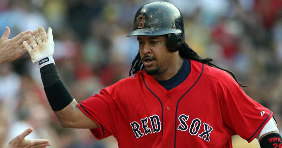 richest baseball players Manny Ramirez #24 of the Boston Red Sox is congratulated after his solo home run