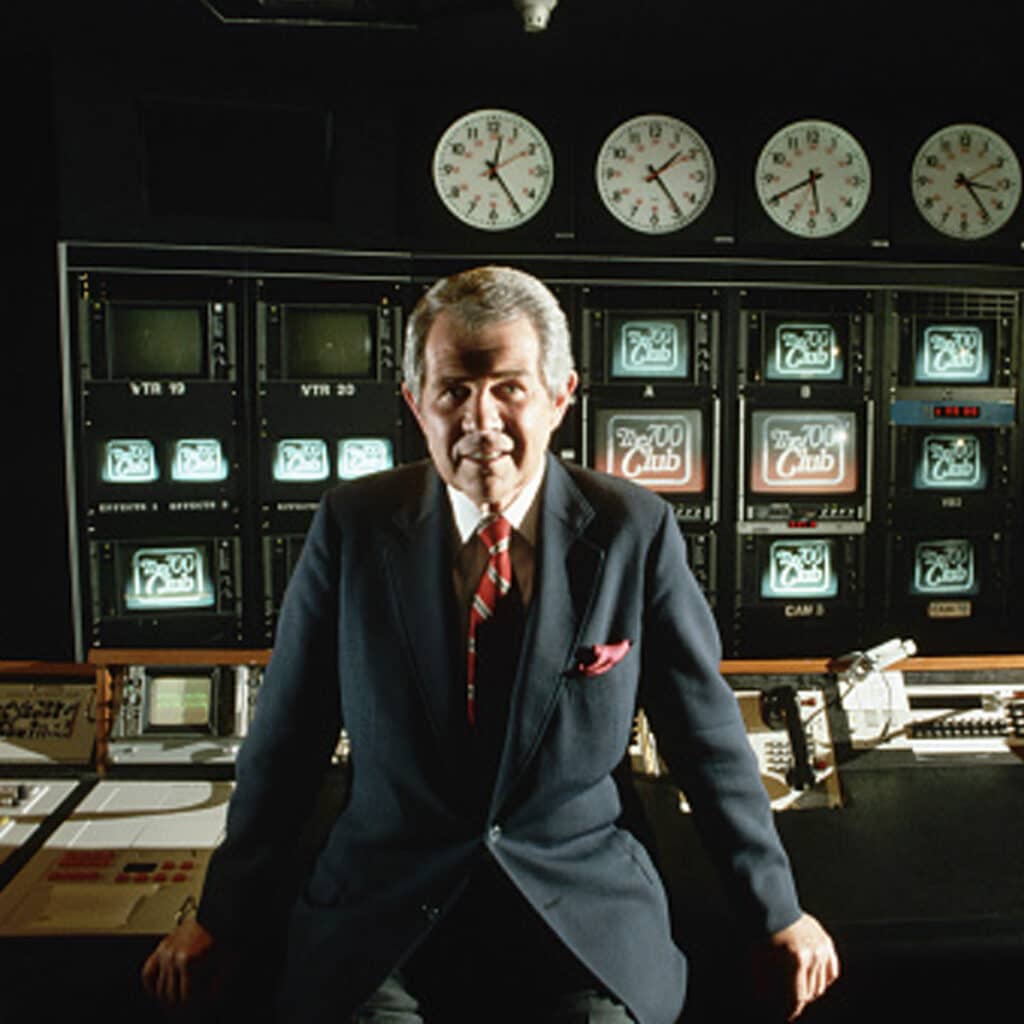 evengelist pat robertson poses in the control room for his 700 club tv show