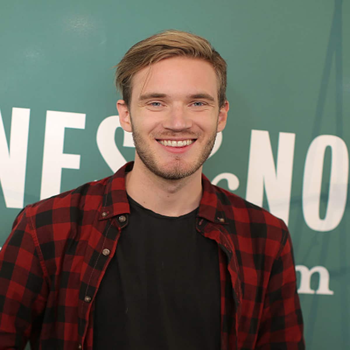 youtuber pewdiepie poses for a photo at his book signing