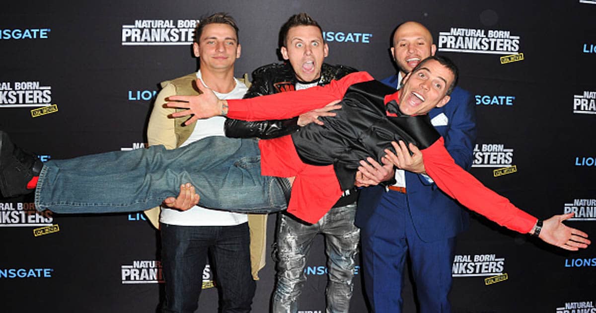 Actors Vitaly Zdorovetskiy, Roman Atwood and Dennis Roady pose for pictures