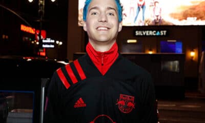 Tyler Blevins poses for a photo outside after the unveiling of the MLS/Adidas 2020 Club