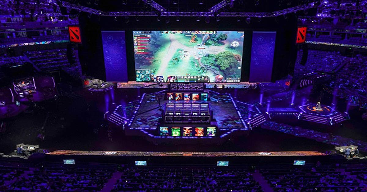 A screen shows a live image of the Dota 2 eSports Best of 5 final match