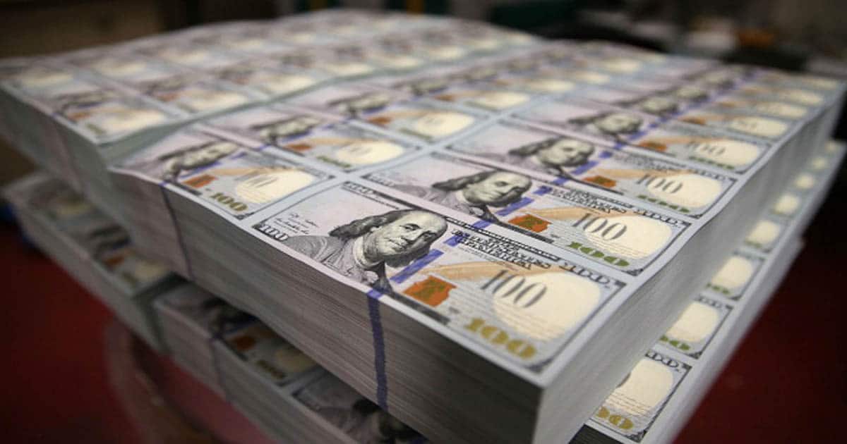 Newly redesigned $100 notes lay in stacks at the Bureau of Engraving and Printing