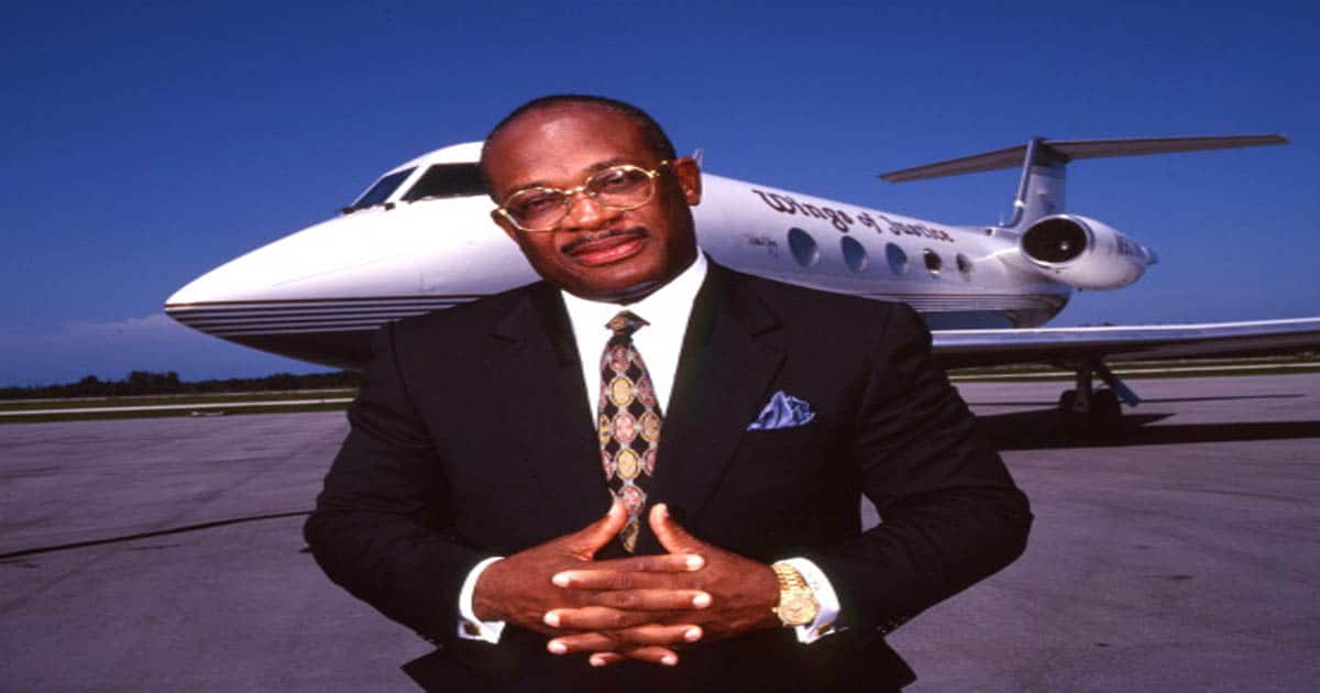 richest lawyers Willie E. Gary standing in front of his private jet 'Wings of Justice'
