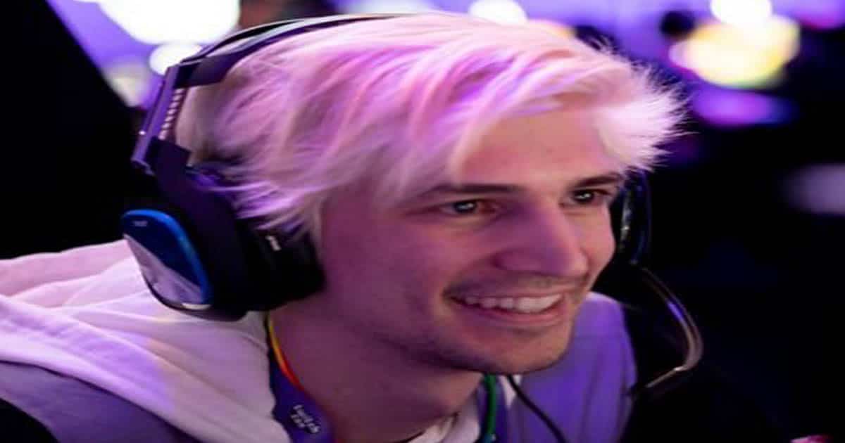 twitch streamer xqc smiles while gaming 