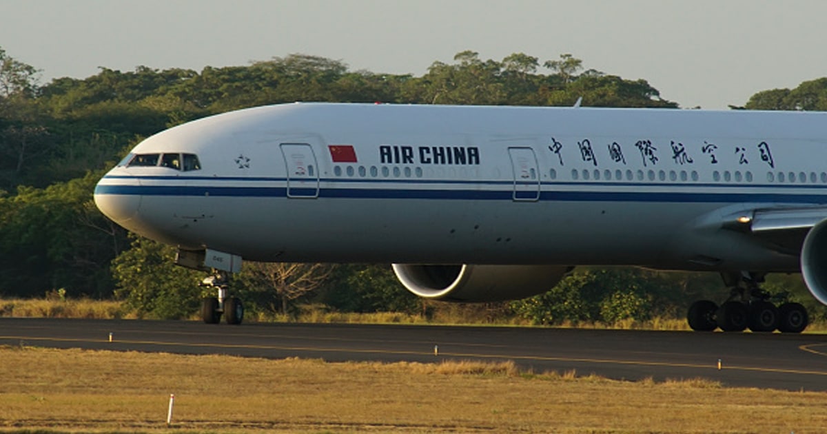 An airplane from Air China lands during the arrival of a new batch of Sinovac vaccines