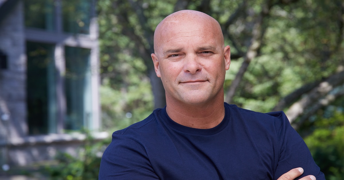 bryan baeumler poses with arms folded for hgtv picture