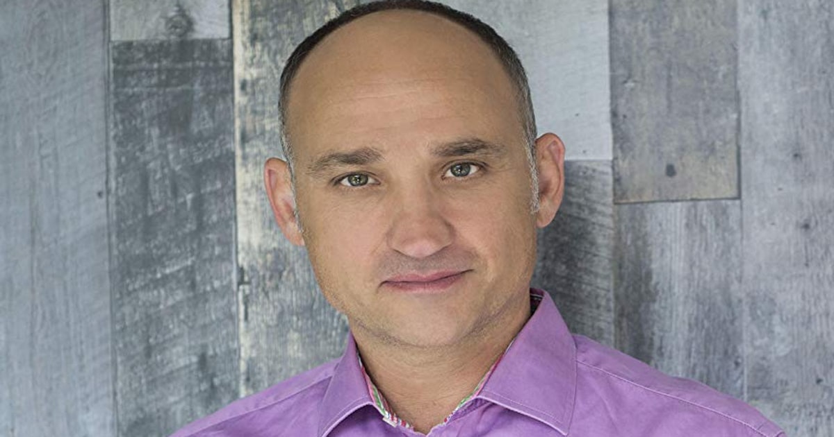 richest hgtv stars david visentin poses in front of grey background