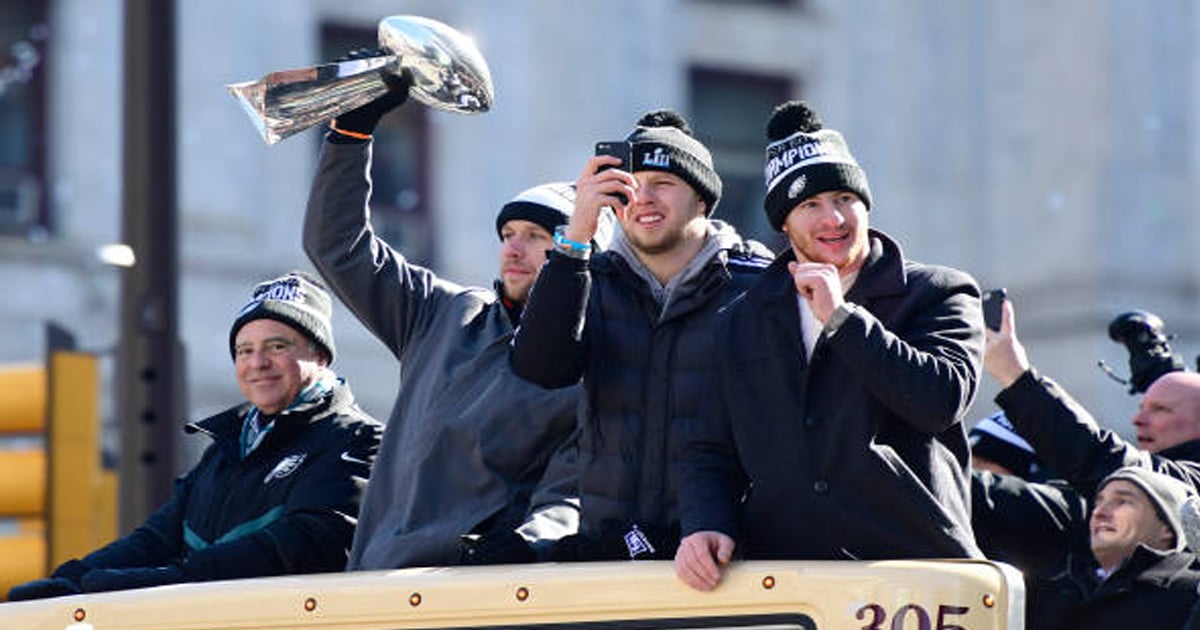 richest nfl owners Nick Foles hoists the Vince Lombardi Trophy as team owner Jeffrey Lurie (L) Nate Sudfeld, and Carson Wentz of the Philadelphia Eagles