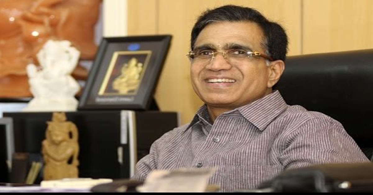 richest jewelers t.s. kalyanaraman sits smiling at desk