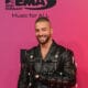 Maluma poses on the red carpet as he arrives for the MTV Europe Music Awards