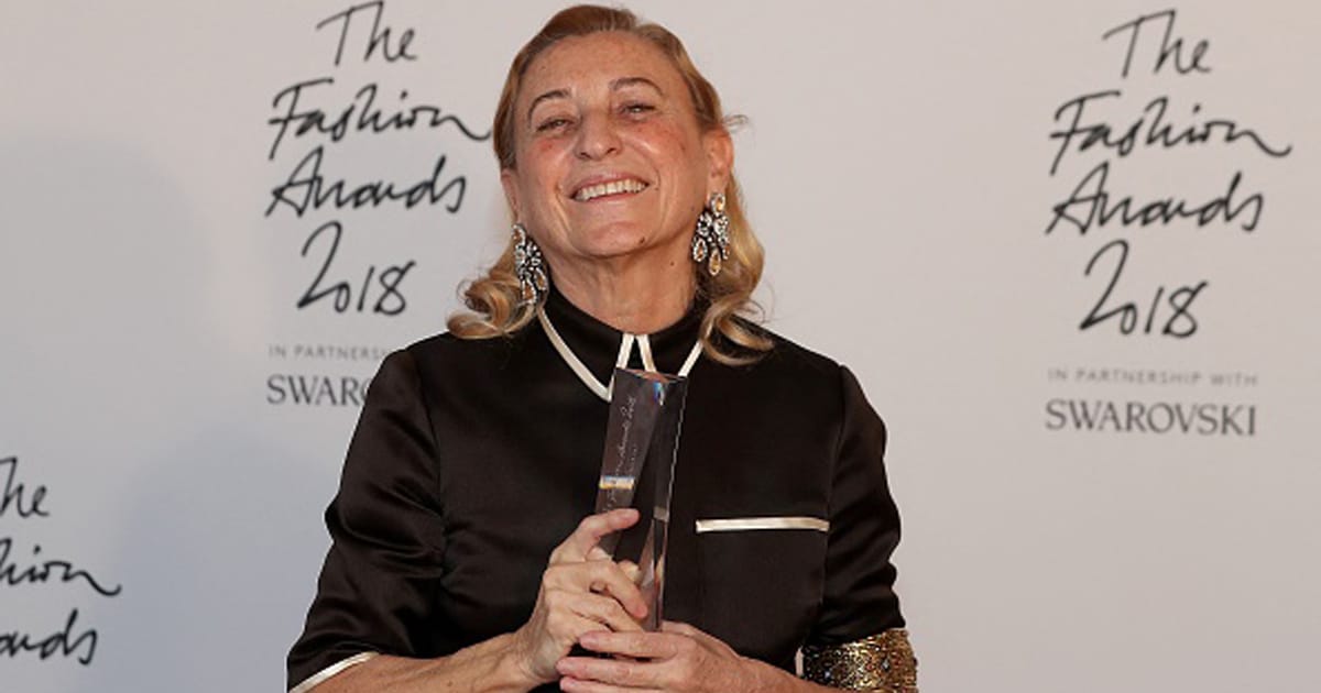 richest fashion designers Miuccia Prada poses with her Outstanding Achievement award