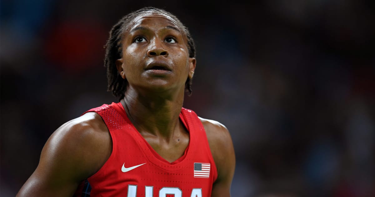 tamika catchings poses on court in usa olympic uniform