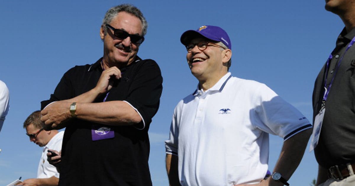 Owner Zygi Wilf of the Minnesota Vikings speaks with U.S. Senator Al Franken (D-MN) during training camp