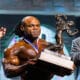 Arnold Schwarzenegger presents the Arnold Classic trophy to Kai Green for winning the Arnold Classic at the Arnold Sports Festival