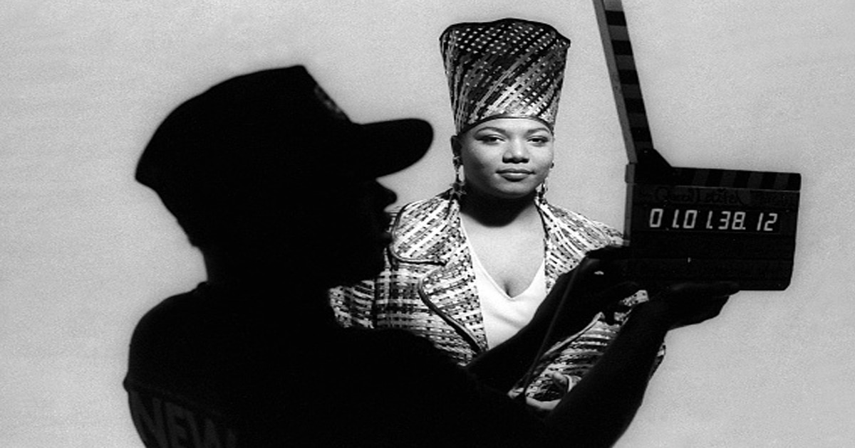 Queen Latifah (Dana Owens) appears with the film slate in the foreground on the set during Queen Latifah's music video shoot 