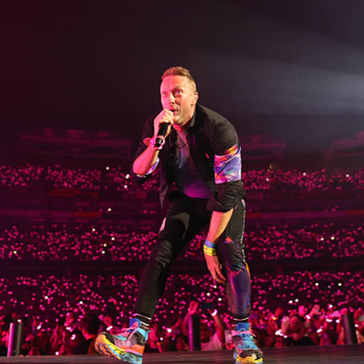 Chris Martin of Coldplay performs onstage during their "Music of the Spheres" trip