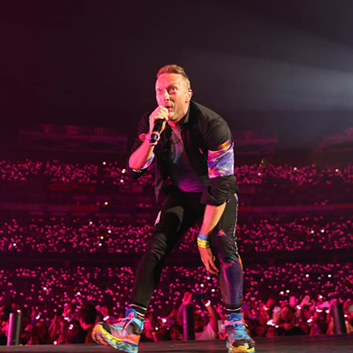 Chris Martin of Coldplay performs onstage during their "Music of the Spheres" tour