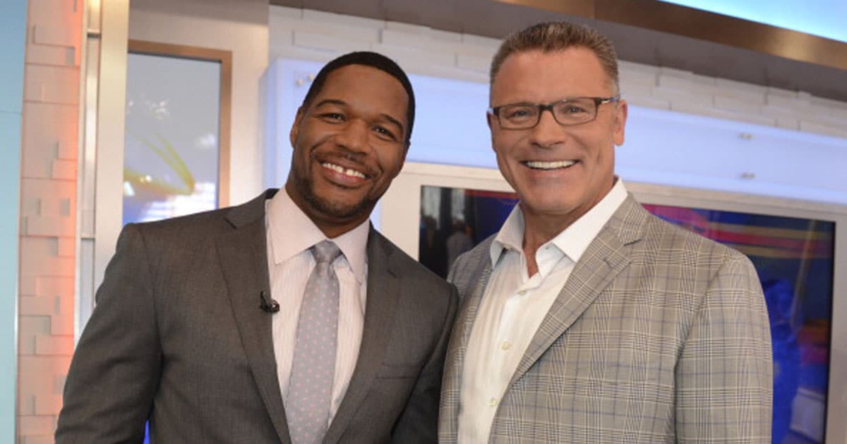 Michael Strahan is surprised by his good friend and colleague, Howie Long, as he is about to be inducted into the Pro Football Hall of Fame