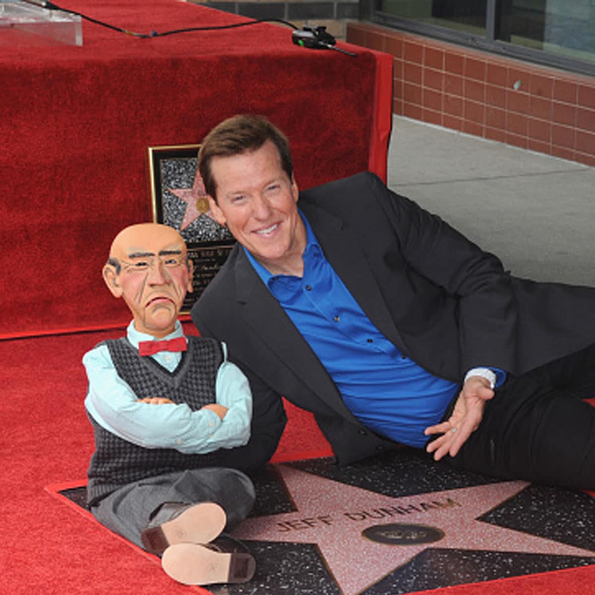Jeff Dunham, posing with his puppet Walter, is honored with a star on The Hollywood Walk of Fame