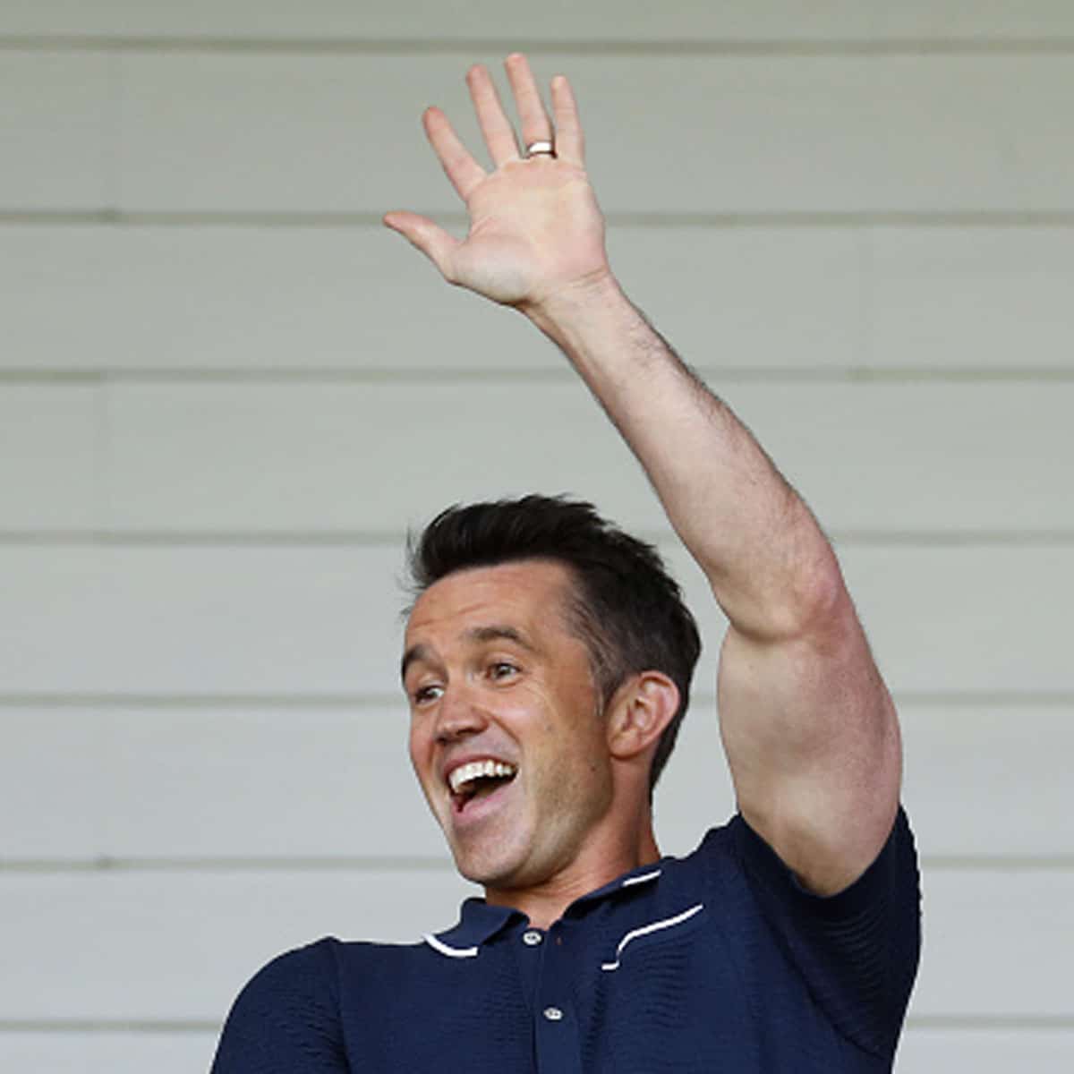 Rob McElhenney, Actor and Co-Owner of Wrexham waves prior to the Vanarama National League Play-Off Semi Final match