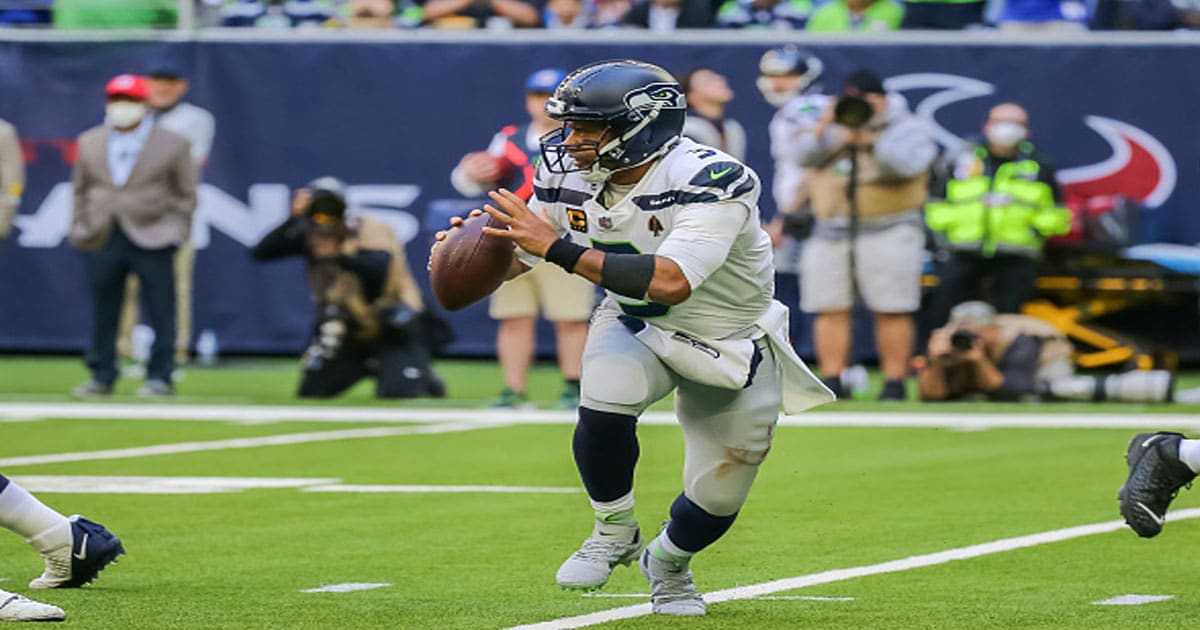 Russell Wilson (3) carries the ball during the NFL football game between the Seattle Seahawks and Houston Texans